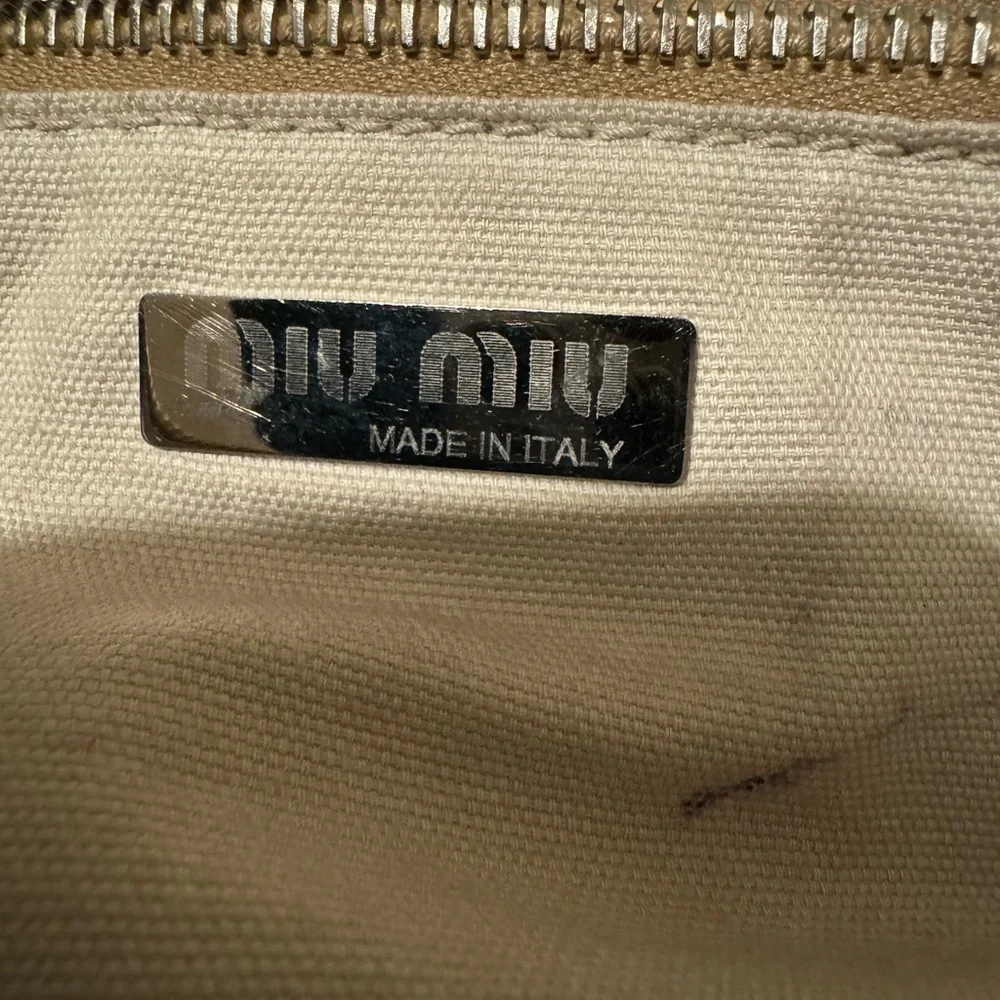 Vintage Miu Miu white leather hobo bag in excellent used condition.